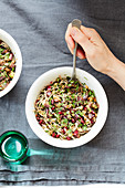 Noodles with aubergines,pomegranate seeds and fresh herbs