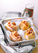 Baked potatoes in their jackets with salt cod brandade,diced bacon and croutons