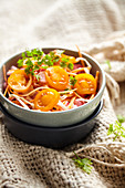 Coleslaw with radishes and yellow cherry tomatoes