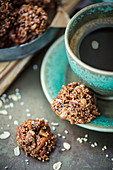 No Bake Cookies with nuts and fruit with a cup of coffee