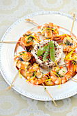 Gambas,Scallop And Citrus Fruit Brochettes With Poppy Seeds,Rice Timbale With Pink Pepper