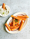 Carrot sticks and herb cream cheese