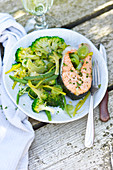 Salmon steak with broccoli,leeks and green beans