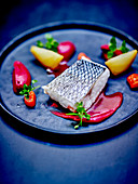 Bass fillet,bitter beetroot puree,yellow beetroot quarters and pepper quenelles