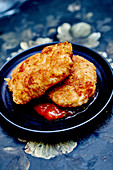 Homemade white fish nuggets with barbecue sauce