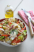 Farfalle mixed salad with olives