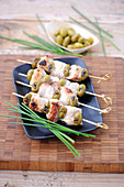 Pork,olive and almond brochettes