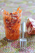 Grated carrot and pomegranate salad with star anise