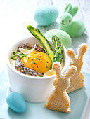 Oeuf cocotte with morels,asparagus and parmesan cream,rabit-shaped bread fingers