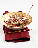 Pig's ears and red onion salad