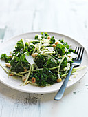 Broccoli leaf salad with onion, celery root, parmesan and hazelnuts