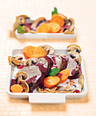 Filet mignon with red wine sauce, carrots and mushrooms