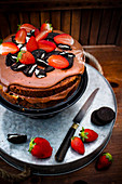 Layer cake with chocolate cream and strawberries