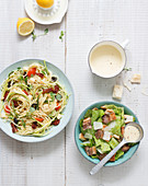 Spaghetti salad with zoodles, tomatoes and olives, Ceasar salad with bacon and parmesan sauce