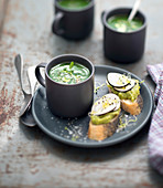Watercress soup, guacamole, black radish and sprout on sliced bread
