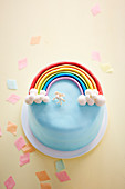 Rainbow cake with a unicorn decoration