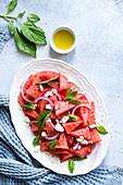 Watermelon and feta salad, with basil, red onion, and olive oil