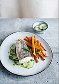 Fish on cucumber salad with baked sweet potato fries