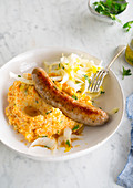 Bratwurst with carrot puree and chicory salad