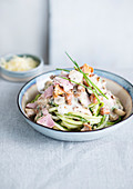 Courgette spaghetti with ham and chanterelle sauce