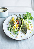 Sea bass fillet with crispy vegetables and mango