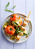 Turkey skewer with stuffed tomatoes