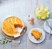 Parmentier with duck confit and pumpkin puree topping