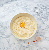 Prepare the shortcrust pastry - add the egg yolk