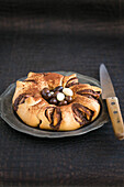 Easter sponge roulade wreath with chocolate eggs
