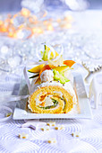 Christmas sponge cake roll with exotic fruits