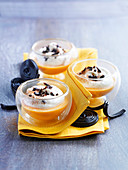 Small pumpkin creams topped with whipped cream and licorice