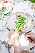 Summer vegetable tart with green vegetables on an outdoor table