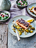 Grilled salmon steak with fried leeks