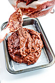 Prepare the chocolate cake: Pour the batter into the baking tin