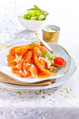 Smoked salmon with roe on a golden spoon (Christmas)