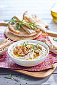 Hummus with white beans and rosemary served with pita bread