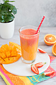 Orange, mango and strawberry smoothie