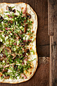 White pizza with mushrooms, bacon and spring onions
