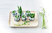 Vegetarian sushi with green asparagus and rocket salad