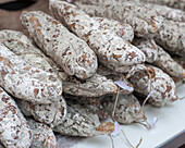 Stacked raw sausage