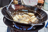 Deep frying spring rolls