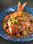 Red snapper a la Vera Cruz - snapper in tomato sauce with capers and olives
