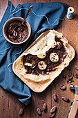 Crepes with chocolate cream and bananas