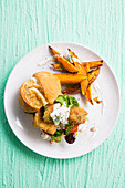Burger of fish and chips and roasted sweet potatoes