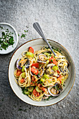 Spaghetti with clams, tomatoes and celery with white wine sauce