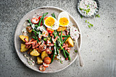 Fried bacon salad, green beans and soft-boiled egg, baked potatoes