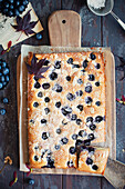 Giant financier with blueberries