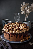 Festive chocolate cake decorated with confectionery and biscuits