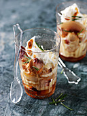 Peach desserts with flaked almonds and rosemary