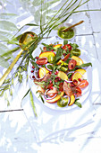 Summer tomato salad with ham and peaches